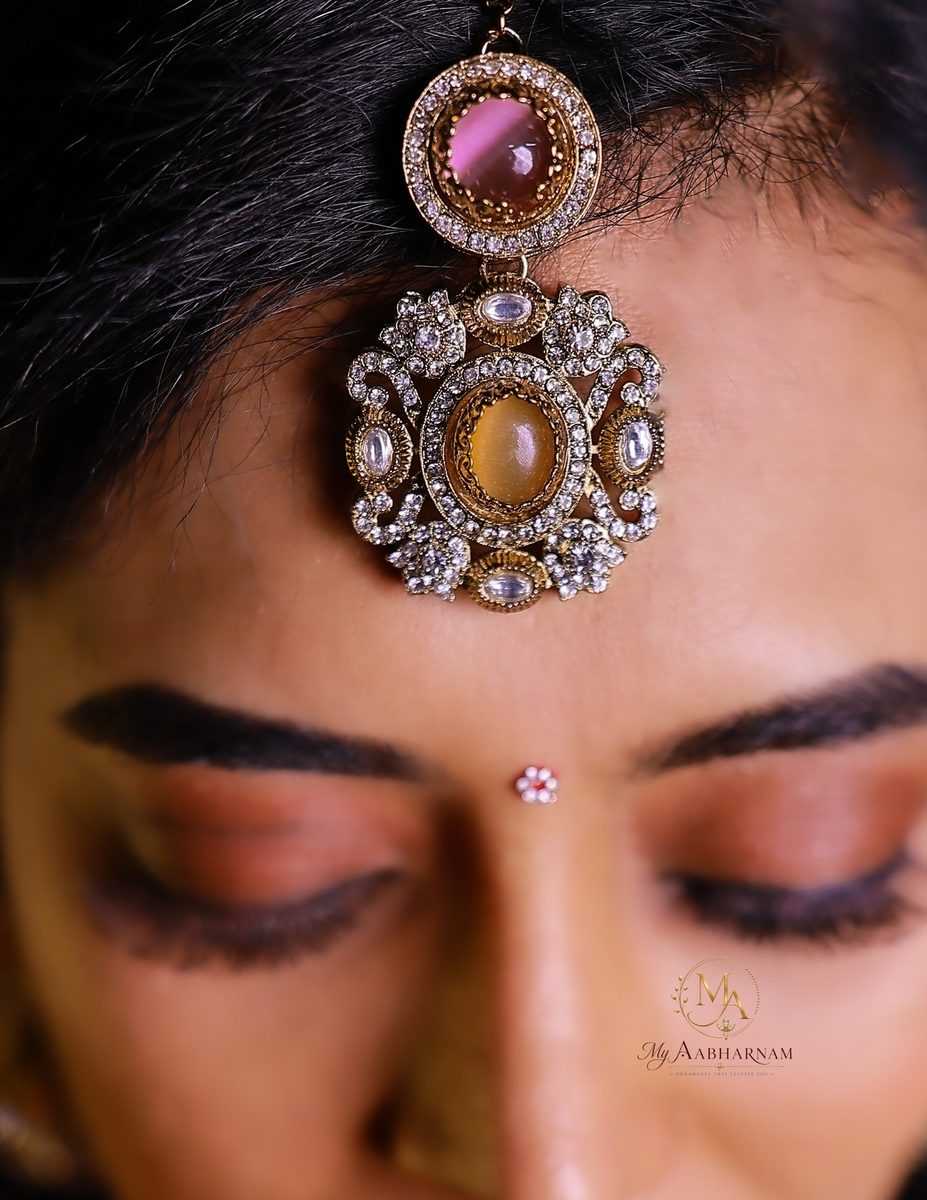 Maang tikka with pink and amber stones