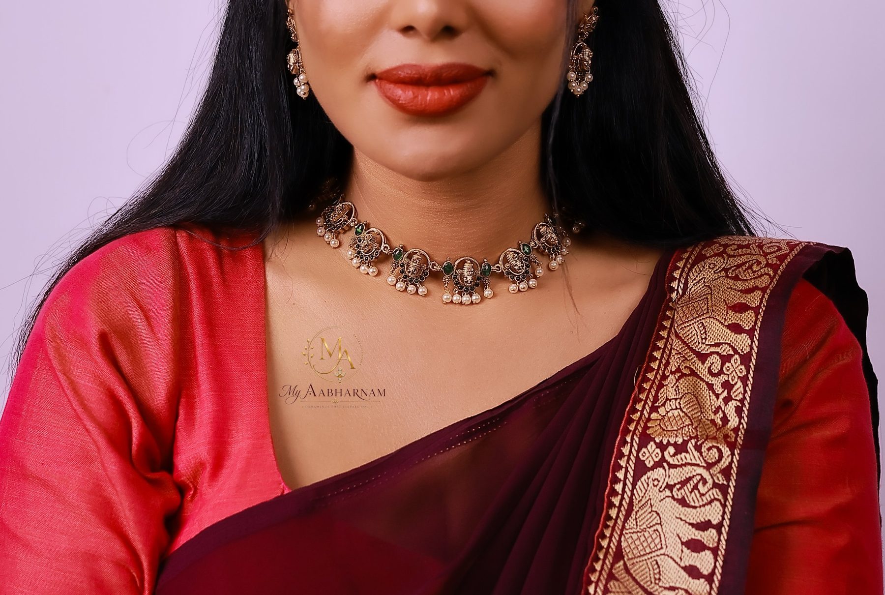Temple choker with pearl drops, worn with a maroon saree